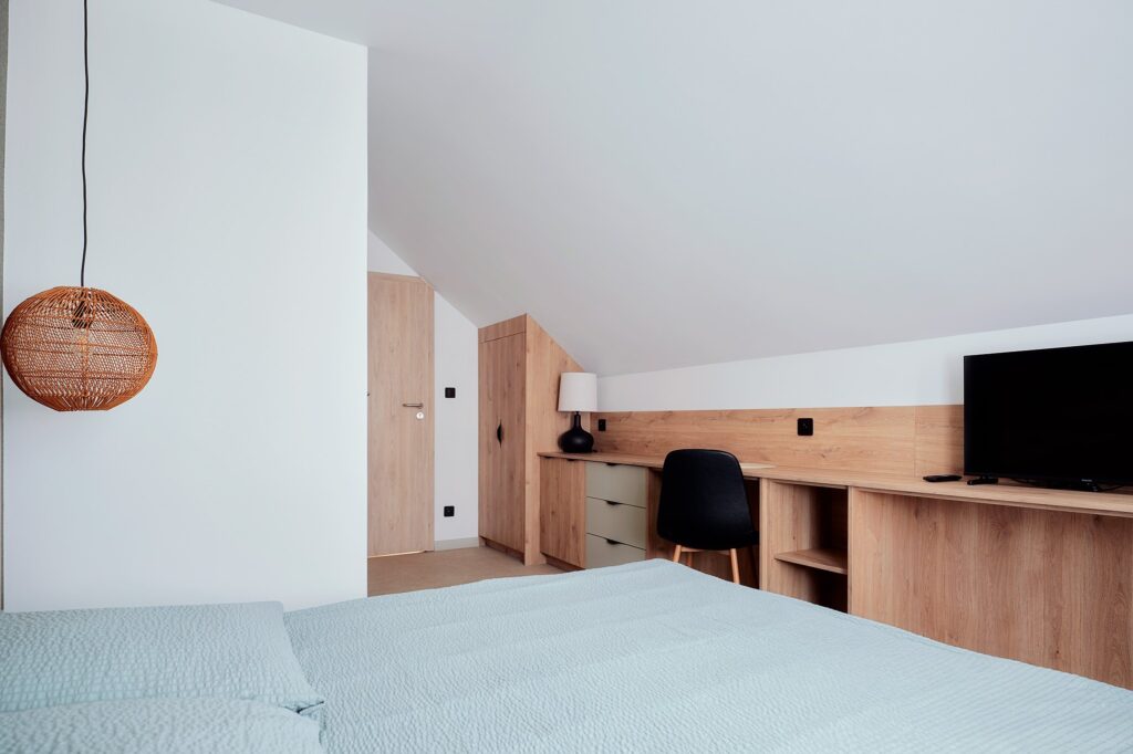 Apartament U Gienia – strefa wypoczynku z TV